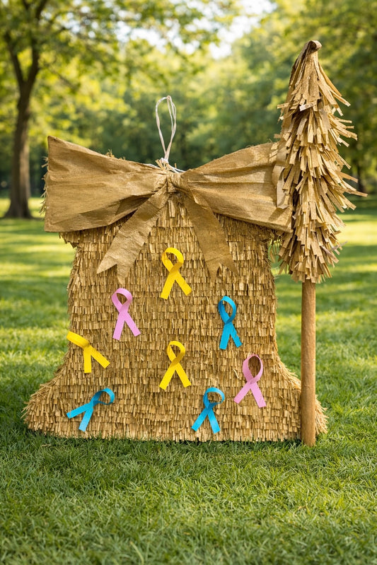 Pinata with colorful ribbons on a grassy outdoor setting